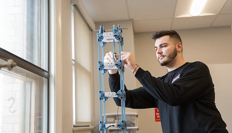 student operating a machine
