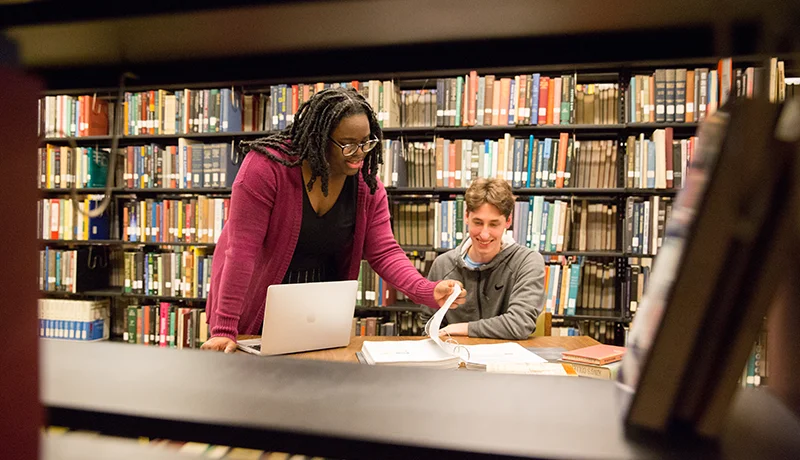 Spanish degree professor and student at the library