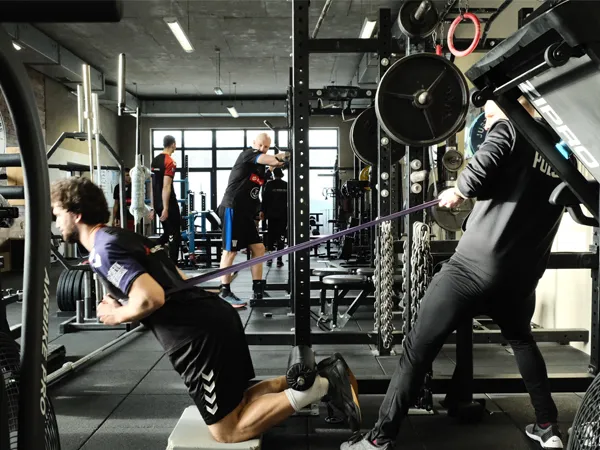 students in the gym using exercise equipment