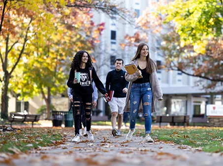 students walking outdoors in fall weather
