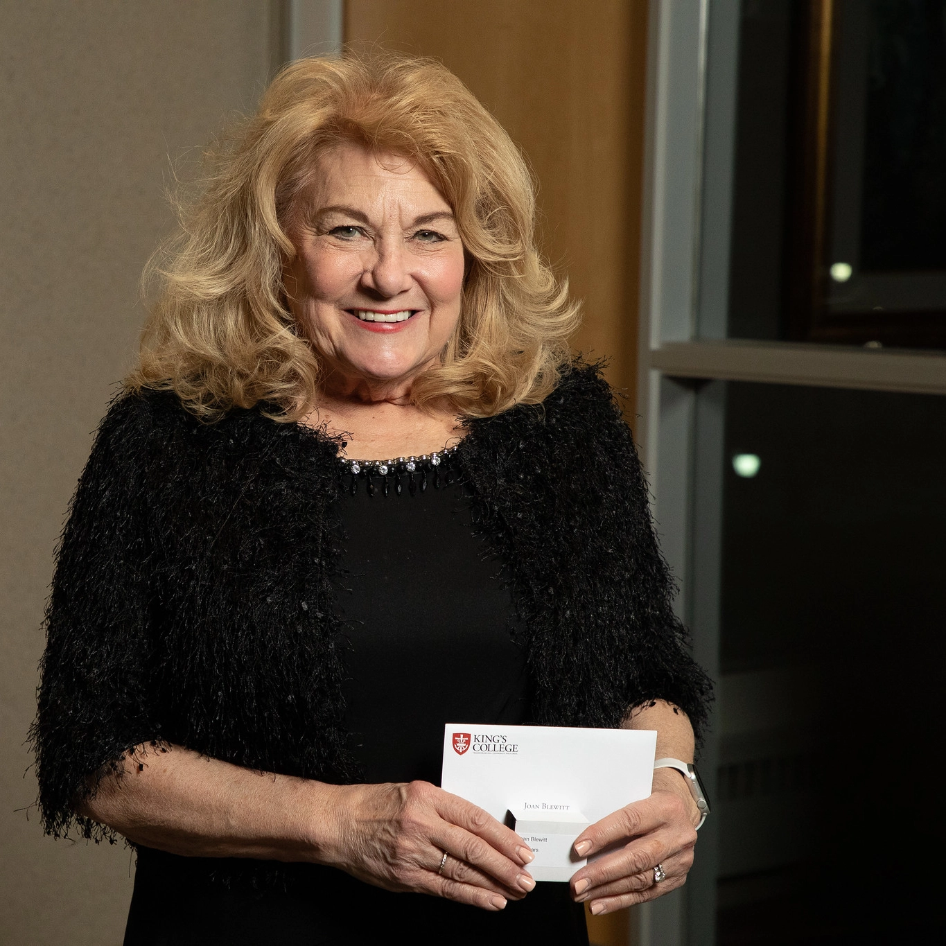 Woman poses at award ceremony