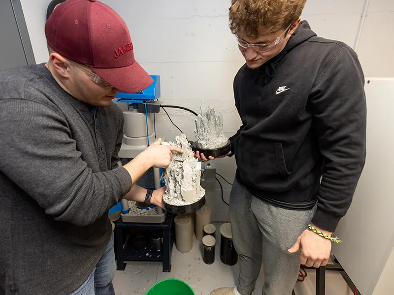 students holding a 3D printed model